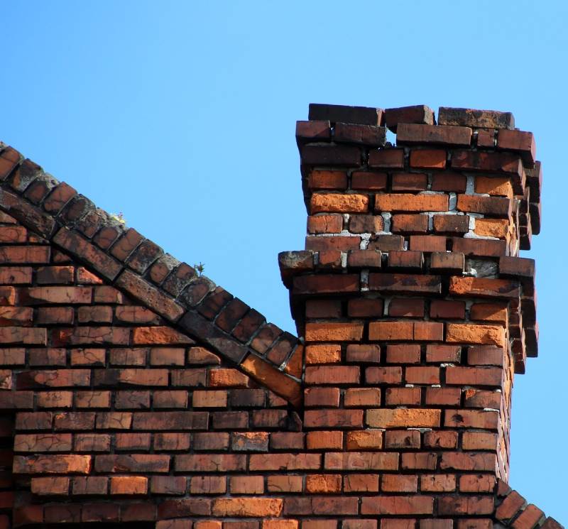 Damaged chimney on an Mangonia Park home showing cracks and missing mortar